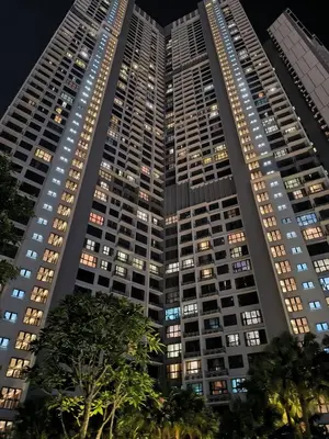 a tall building at night with lights on at Bukit Bintang Agile Residence TRX in Kuala Lumpur