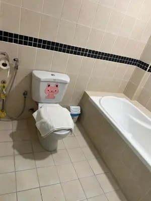 a bathroom with a toilet and a bath tub at Seri bukit ceylon kl in Kuala Lumpur
