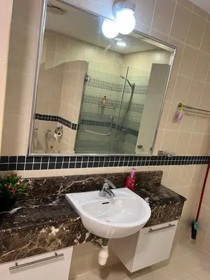 a bathroom with a sink and a mirror at Seri bukit ceylon kl in Kuala Lumpur