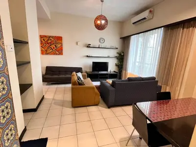 a living room with two couches and a tv at Seri Bukit Ceylon Apartment Bukit Bintang in Kuala Lumpur