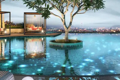 a pool with a tree and a view of a city at 28 Boulevard - Pandan Perdana Cheras KL in Kuala Lumpur