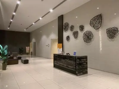 a lobby with a reception desk and hearts on the wall at 28 Boulevard - Pandan Perdana Cheras KL in Kuala Lumpur