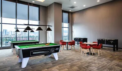 a room with a pool table and ping pong tables at 28 Boulevard - Pandan Perdana Cheras KL in Kuala Lumpur