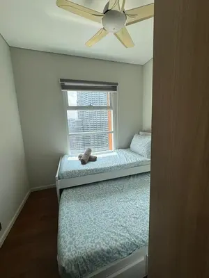 a bedroom with a bed and a ceiling fan at Nest In The Sky in Kuala Lumpur