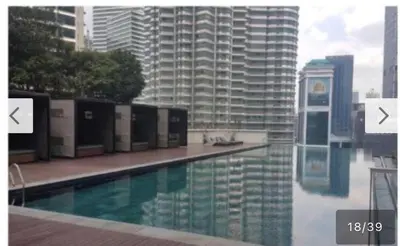 a swimming pool on top of a tall building at Avenue K in Kuala Lumpur
