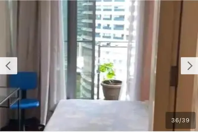 a room with a window with a potted plant next to it at Avenue K in Kuala Lumpur