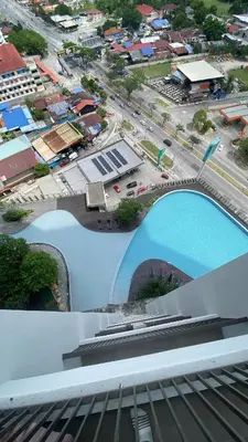 a collage of two pictures of a city and a pool at COZY Kenwingston platz KL 2-5PAX Klcc View Pakin Nefix Free parkin 1807 in Kuala Lumpur