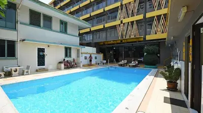 a large swimming pool in front of a building at The Nest Service Apartment in Kuala Lumpur