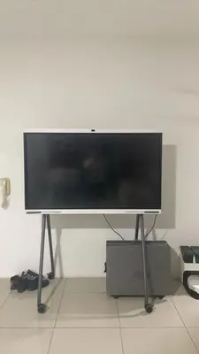 a flat screen tv on a stand in a room at The Nest Service Apartment in Kuala Lumpur