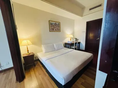 a bedroom with a large white bed in a room at My Residence suite at Berjaya times square Kl in Kuala Lumpur