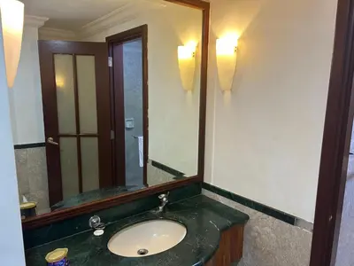 a bathroom with a sink and a large mirror at My Residence suite at Berjaya times square Kl in Kuala Lumpur