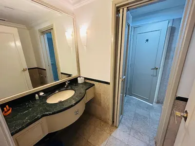 a bathroom with a sink and a large mirror at My Residence suite at Berjaya times square Kl in Kuala Lumpur