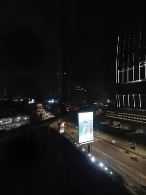 a view of a city at night at Politeknik metro kl in Kuala Lumpur