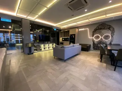 a living room with a couch and a table at Ceylonz Suites by Stayla in Kuala Lumpur