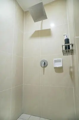 a bathroom with a shower with a glass door at A Cozy & Comfy Studio in KLCC with KL Tower View in Kuala Lumpur