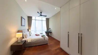 a bedroom with a bed and a window at Manor Residence KLCC - LV Home in Kuala Lumpur