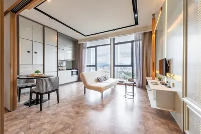 a living room with a couch and a table at KLCC Expressionz Couple Suites 1B1B in Kuala Lumpur