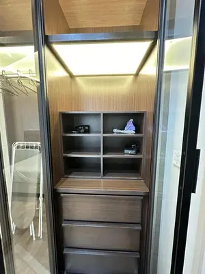 a walk in closet with some shoes in it at KLCC Expressionz Couple Suites 1B1B in Kuala Lumpur
