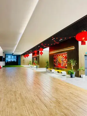 a large hall with a wooden floor and red lights at SS Luxury Suites AT TM Persiaran Stonor KLCC in Kuala Lumpur