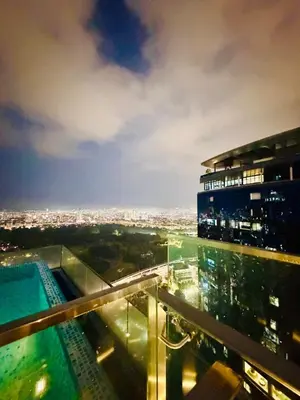 a building with a swimming pool on top of it at SS Luxury Suites AT TM Persiaran Stonor KLCC in Kuala Lumpur