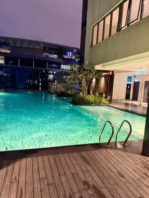 a swimming pool in the middle of a building at SS Luxury Suites AT TM Persiaran Stonor KLCC in Kuala Lumpur