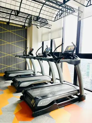 a row of treadmills in a gym at Scarletz Villa Near By KLCC in Kuala Lumpur