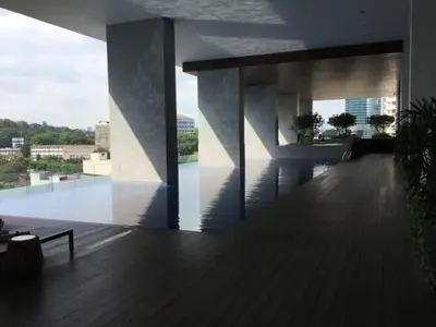 a building with a deck with a view of a city at Mindful Bangsar Loft KL Sentral Mid Valley The Gardens Pasar Seni in Kuala Lumpur