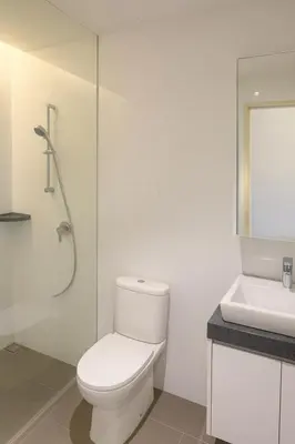 a white bathroom with a toilet and a sink at Mindful Bangsar Loft KL Sentral Mid Valley The Gardens Pasar Seni in Kuala Lumpur