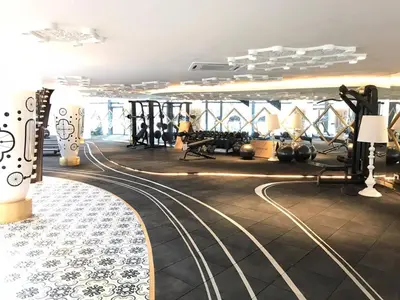 a gym with a track in the middle of a room at ARTE Mont Kiara Designer Suites by HOST CORNER in Kuala Lumpur