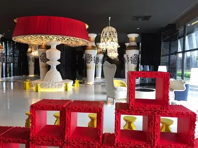a room with red and white furniture and lamps at ARTE Mont Kiara Designer Suites by HOST CORNER in Kuala Lumpur
