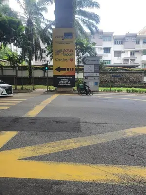 a street with a sign on the side of the road at Kiaramas Gateway Residence in Kuala Lumpur