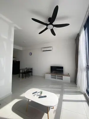 a living room with a ceiling fan and a table at MAJESTIC RESlDENCE KLCC in Kuala Lumpur