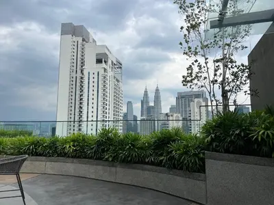a view of a city skyline from a building at MAJESTIC RESlDENCE KLCC in Kuala Lumpur