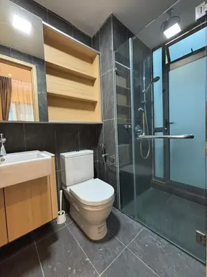 a bathroom with a toilet and a shower and a sink at KLCC Cozy Suite 21F with Best View Infinity Pool in Kuala Lumpur