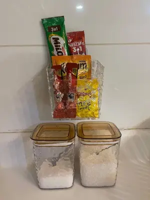 two containers of food sitting on top of a refrigerator at Arte Ampang KLCC 2 BR Homestay, 4-6 pax in Ampang