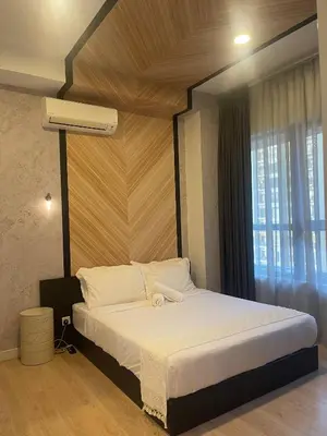 a bedroom with a large bed with a large window at Arte Ampang KLCC 2 BR Homestay, 4-6 pax in Ampang