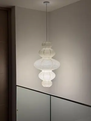 a cluster of lights hanging from a wall at Deluxe Duplex Studio Suite at Agile Bukit Bintang in Kuala Lumpur