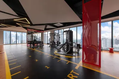 a gym with a view of the city at Majestic by Avery at KLCC#Located in the City Center#10 mins Walk to Twin Towers#Rooftop Infinity pool#\u4e2d\u82f1\u6587\u623f\u4e1c in Kuala Lumpur