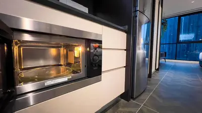 a toaster oven on a wall in a room at Scarletz Suite KLCC By Light House 3 in Kuala Lumpur