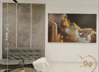 a painting on a wall next to a couch at Stay At KL 4 pax at Bukit Bintang KL Monorail in Kuala Lumpur