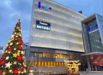 a christmas tree in front of a hotel at Stay At KL 4 pax at Bukit Bintang KL Monorail in Kuala Lumpur