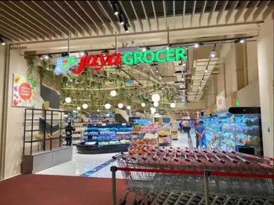 a grocery store with a cart in the aisle at Stay At KL 4 pax at Bukit Bintang KL Monorail in Kuala Lumpur