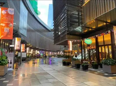 an empty street in a city with buildings at Stay At KL 4 pax at Bukit Bintang KL Monorail in Kuala Lumpur