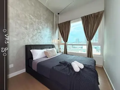 a bedroom with a bed with a large window at VR3 2R2B 6pax Sunway Velocity LINK Mall MRT in Kuala Lumpur