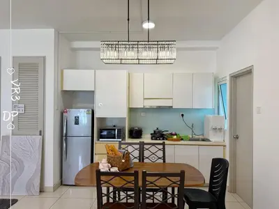 a kitchen with a table and chairs and a refrigerator at VR3 2R2B 6pax Sunway Velocity LINK Mall MRT in Kuala Lumpur
