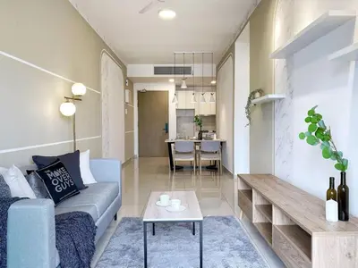 a living room with a couch and a table at Cozy Stay at Legasi 5 minutes Walking distance to KLCC in Kuala Lumpur