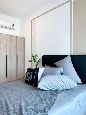 a bedroom with a large bed with blue sheets at Cozy Stay at Legasi 5 minutes Walking distance to KLCC in Kuala Lumpur