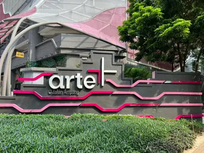 a sign on the side of a building at Sweethome in Kuala Lumpur