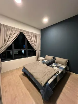 a bedroom with a large bed and a window at Sweethome in Kuala Lumpur