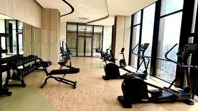 a gym with treadmills and ellipticals in a building at Visitors Axon Residence Bukit Bintang KL City Center in Kuala Lumpur
